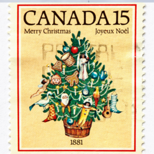 kanadyjski znaczek pocztowy, żółty, w centrum choinka, napisy "wesołych świąt" w językach angielskim i francuskim
